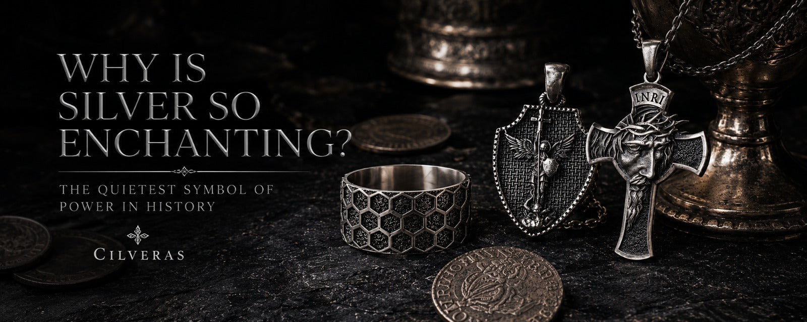 925 sterling silver jewelry by Cilveras displayed with rings, cross necklaces, and ancient silver coins in a dark historical luxury style.